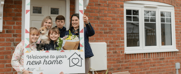 Councillor Victoria Atherstone Cheltenham Borough Council member for housing with CBH customer Sarah and her family at Hillfort Place.